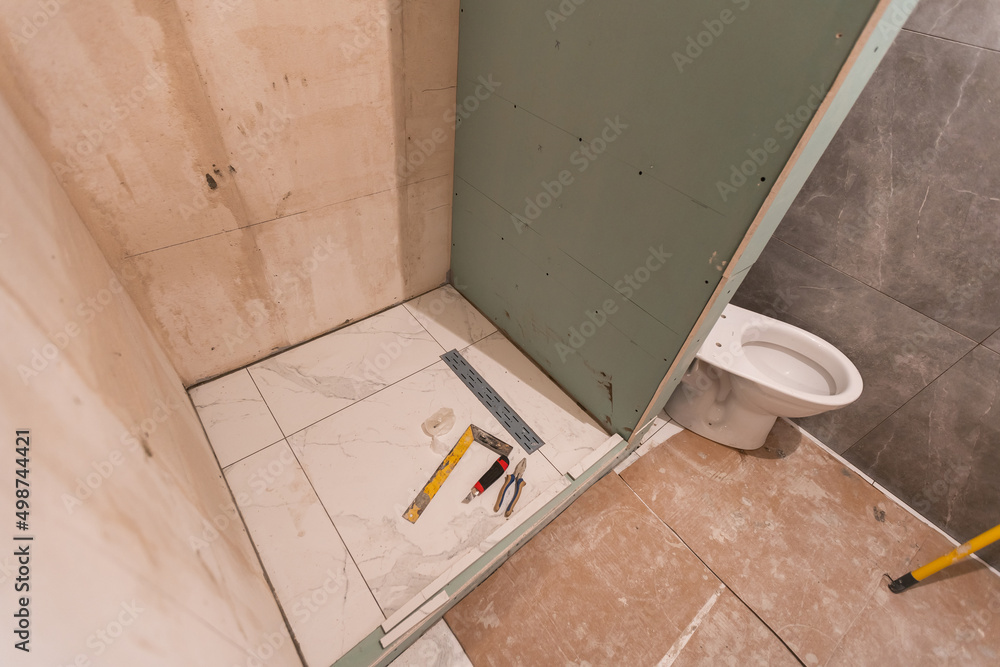 bathroom renovation and tiling. Laying floor ceramic tile bathroom renovation and tiling. Laying floor ceramic tile