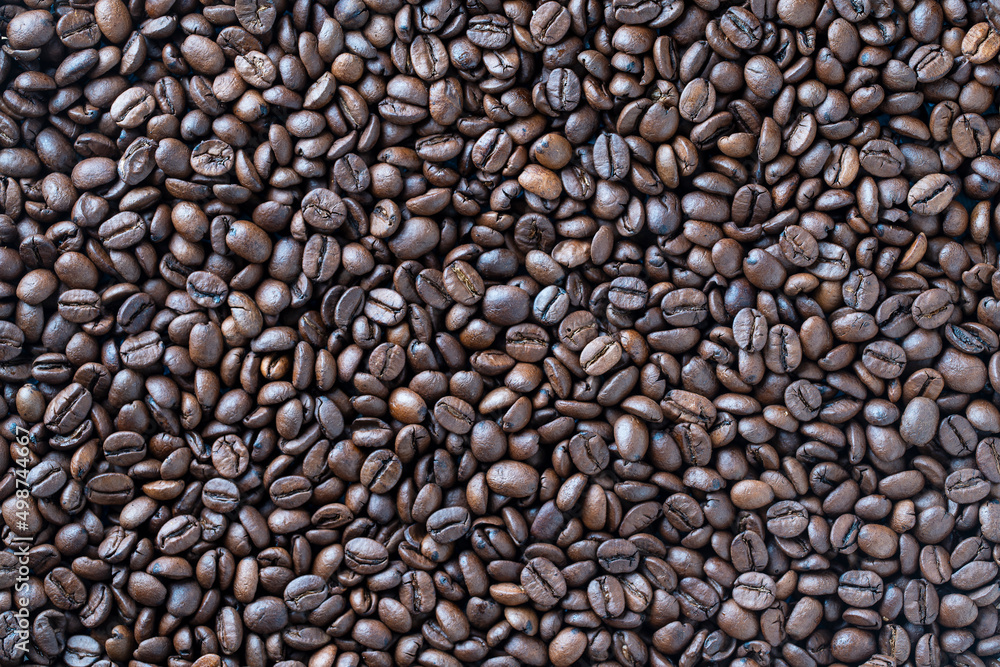 Background of fresh roasted coffee beans, close up, top view Background of fresh roasted coffee beans, close up, top view