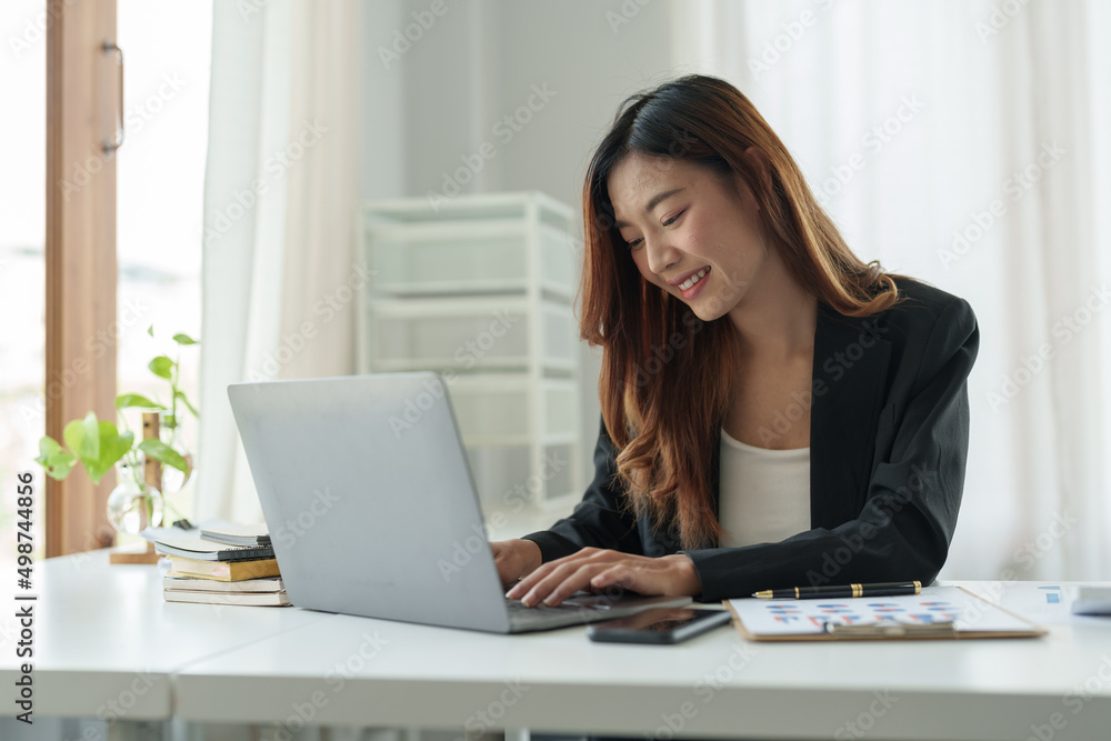 Young beautiful asian woman typing on laptop computer for online webinar learning virtual internet online class from school teacher by remote meeting Young beautiful asian woman typing on laptop computer for online webinar learning virtual internet online class from school teacher by remote meeting
