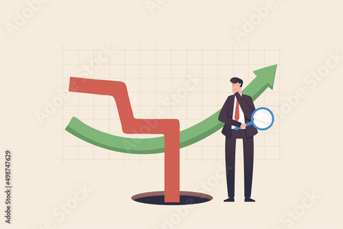Economics, stagflation or recession inflation is a situation in which the inflation rate is high, the economic growth rate slows. Businessman standing and looking at the downward arrow graph in surpri photo