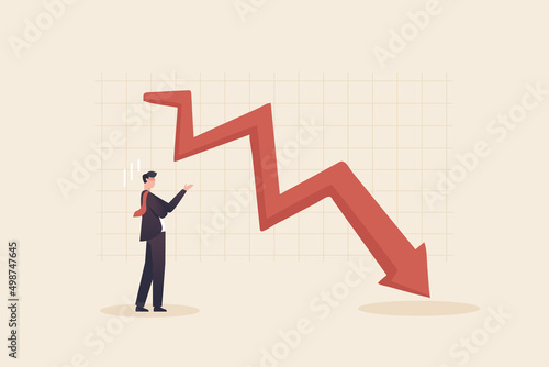 Financial Crisis , Stock Market Plunge. Businessman looks at the graph and is depressed.
