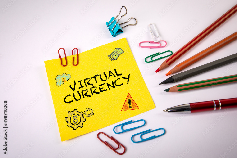 Virtual Currency. Text and drawing on a ellow note sheet Virtual Currency. Text and drawing on a ellow note sheet