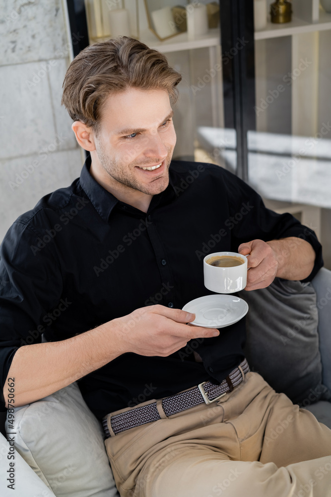 happy and stylish man sitting with morning coffee at home. happy and stylish man sitting with morning coffee at home.
