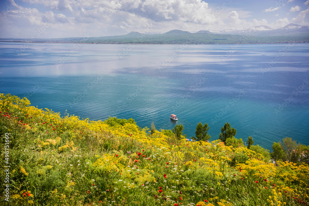 Beautiful view of Sevan lake with turquoise water and green hills, Sevan, Armenia 