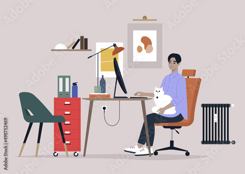 A young male Asian character working with a cat on their lap, home office interior