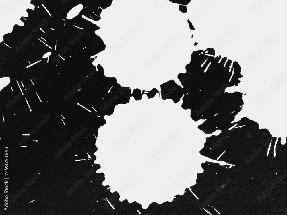 Obraz premium Blobs of white paint on a black background.