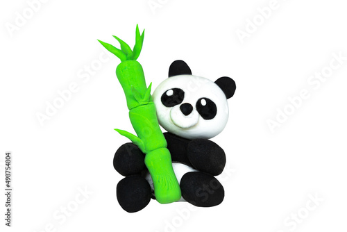 Plasticine panda with bamboo. Isolated on white photo