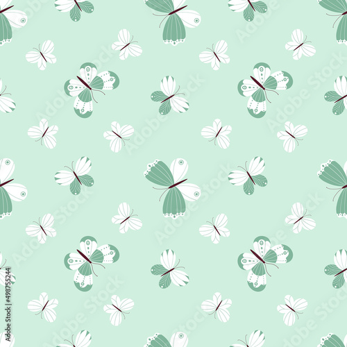Seamless vector pattern with a variety of butterflies on a light green background.
