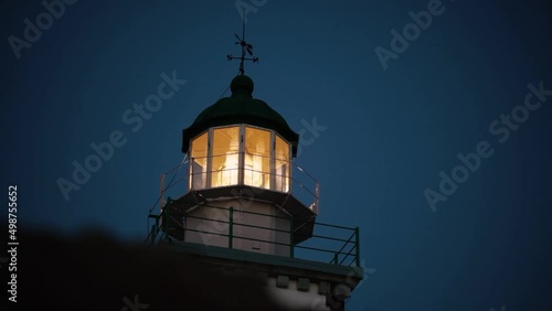 Lighthouse, evening, lantern, lighthouse light, lighthouse spinning, on the island, Santorini, Greece getting dark speed up video