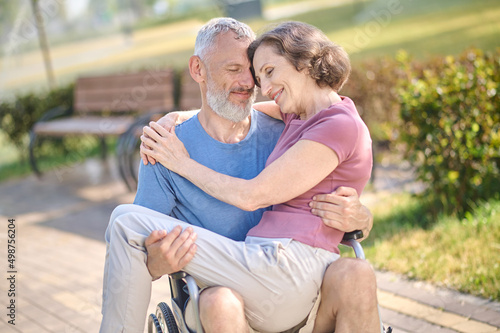 A couple in the park looking happy and romantic