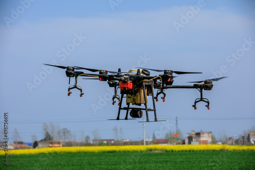 Agricultural drone spraying pesticides. Drones are used in agriculture.