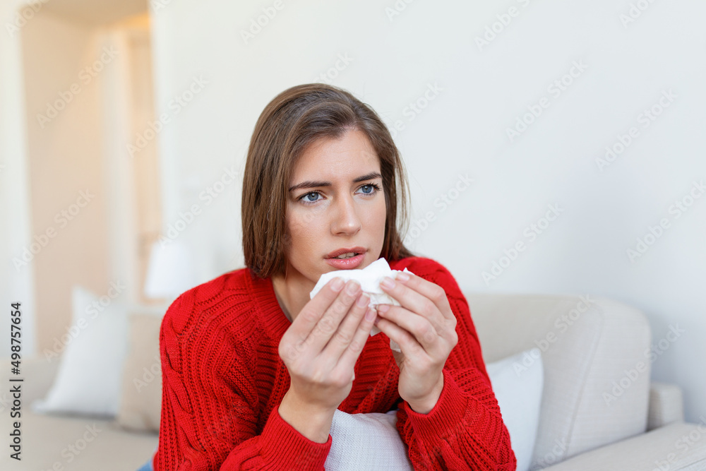 Sick desperate woman has flu. Rhinitis, cold, sickness, allergy concept. Pretty sick woman has runnning nose, rubs nose with handkerchief. Sneezing female. Brunette sneezing in a tissue Sick desperate woman has flu. Rhinitis, cold, sickness, allergy concept. Pretty sick woman has runnning nose, rubs nose with handkerchief. Sneezing female. Brunette sneezing in a tissue