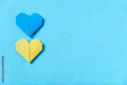 Blue and yellow paper hearts, Ukrainian flag. Solidarity with Ukraine