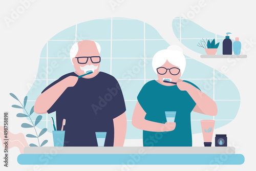 Older couple doing morning routine together. Grandma and grandpa brushing teeth in bathroom