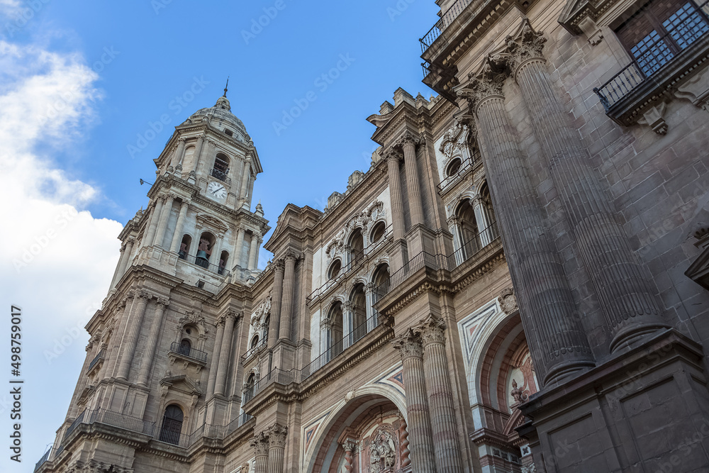 Detailed view at the front facade at the Malaga Cathedral or Santa Iglesia Catedral Basílica de la Encarnación, and Obispo square