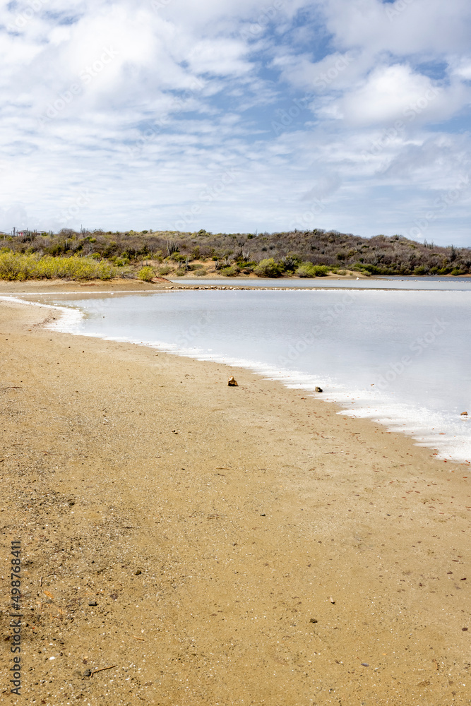 Walk along the salty shores of the Jan Thiel lagoon on the Caribbean island Curacao