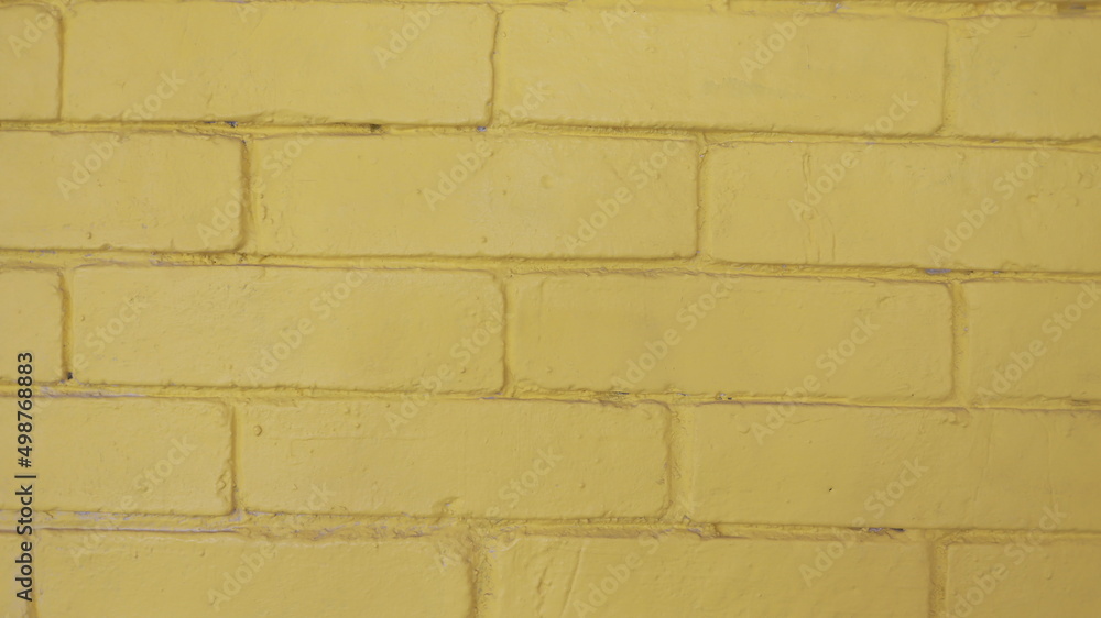 Pared amarilla de ladrillos pintado, textura rustica Pared amarilla de ladrillos pintado, textura rustica