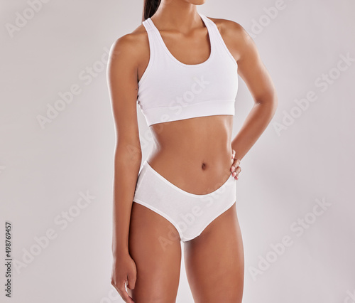 My body, my rules. Cropped shot of a fit young woman posing in her underwear against a studio background.