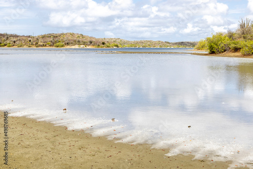 Walk along the salty shores of the Jan Thiel lagoon on the Caribbean island Curacao photo