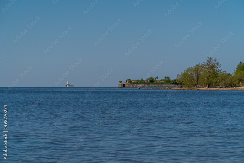 Russia. Kronstadt. May 30, 2021. The Reef Fort and Tolbukhin Lighthouse are on the horizon.