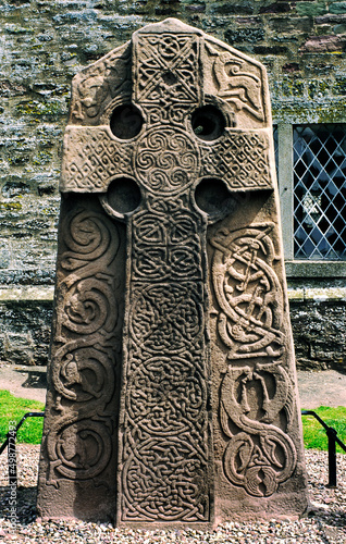 Celtic Pictish Christian cross slab in Aberlemno churchyard, Tayside, Scotland. Intricate knotwork and animal motifs photo