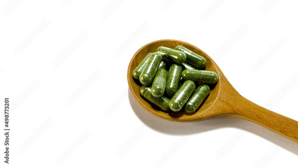 dry herbal capsule on hand isolated on white dry herbal capsule on hand isolated on white