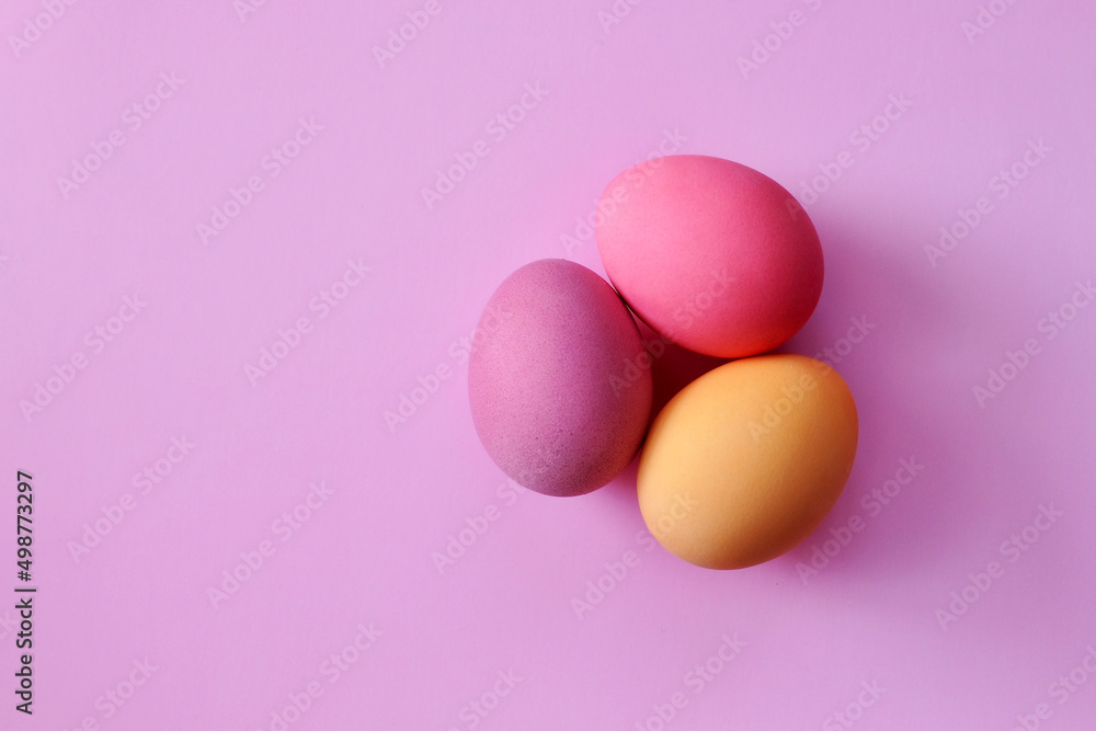 Preparation for the Easter holiday. Eggs and Easter decor on a bright background.