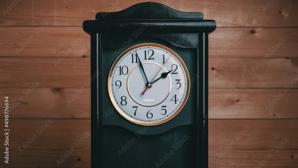 Timelapse of vintage clock with full turn of time hands at 2 am or pm