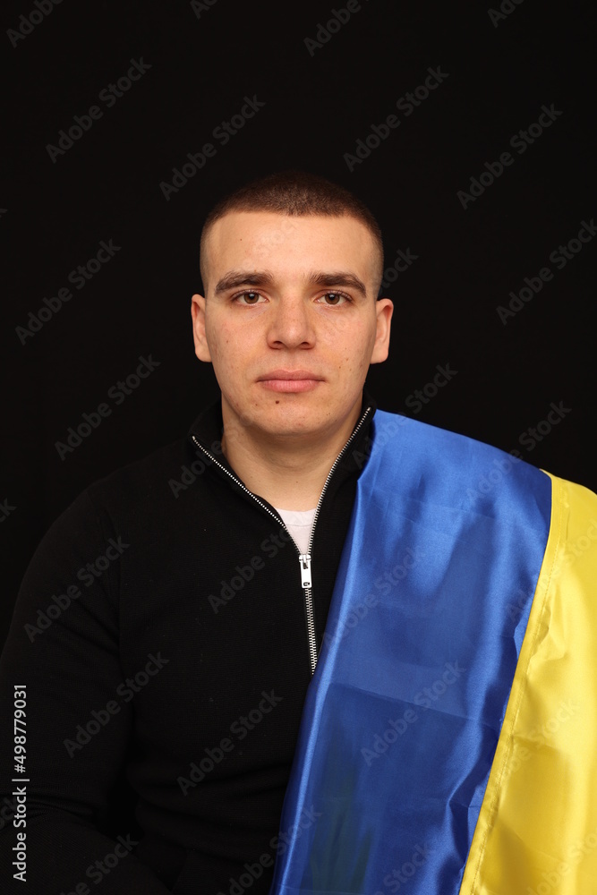 Ukraine flag on black background. war in Ukraine. patriot of his state. yellow and blue flag. Love your country. Victory Day in the war Ukraine flag on black background. war in Ukraine. patriot of his state. yellow and blue flag. Love your country. Victory Day in the war
