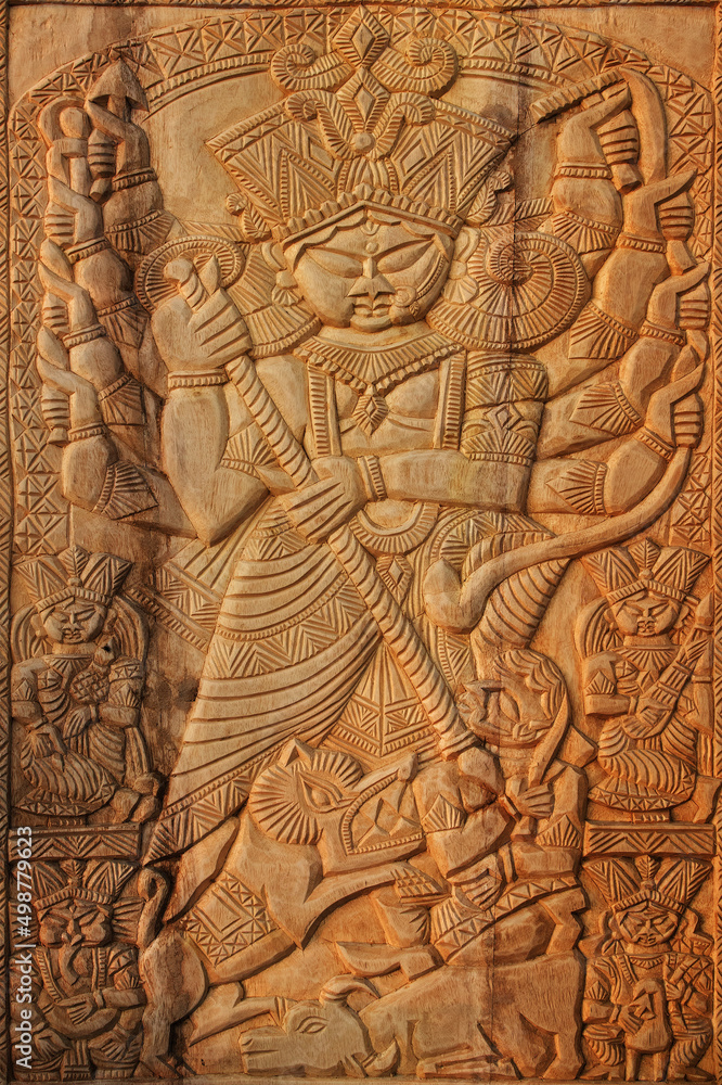 KOLKATA, WEST BENGAL , INDIA - NOVEMBER 23RD 2014 : Wood made Goddess Durga, handicrafts on display during the Handicraft Fair in Kolkata - the biggest handicrafts fair in Asia. KOLKATA, WEST BENGAL , INDIA - NOVEMBER 23RD 2014 : Wood made Goddess Durga, handicrafts on display during the Handicraft Fair in Kolkata - the biggest handicrafts fair in Asia.
