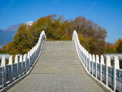 Stairway with lion sculptures along the bridge at qingxi reservoir photo