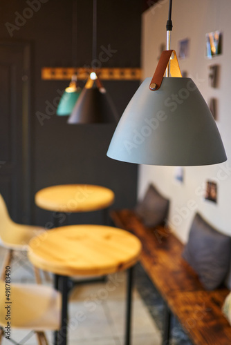 modern gray lamp close-up. empty tables in a cafe in a loft style photo