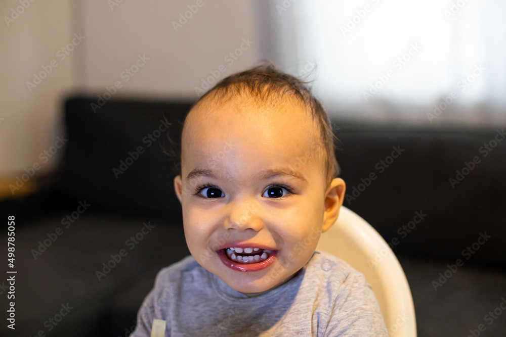 Happy baby boy smiling with teeth looking to camera Happy baby boy smiling with teeth looking to camera