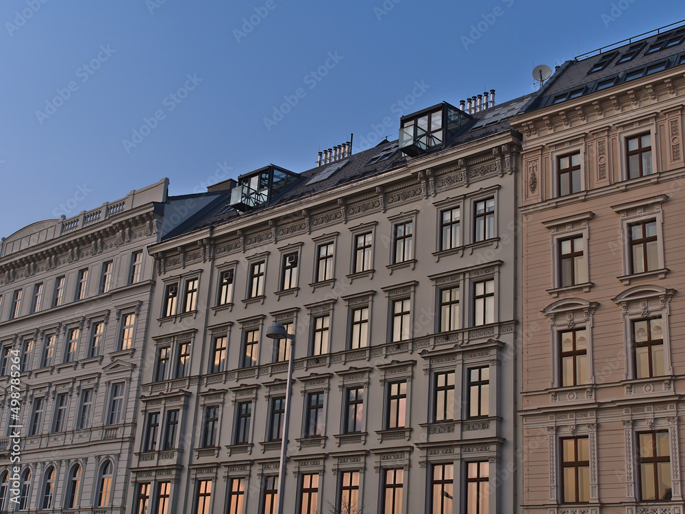 View of characteristic old buildings (constructed ca. 1900) in the historic center of city Vienna, Austria in the evening with decorative facades.