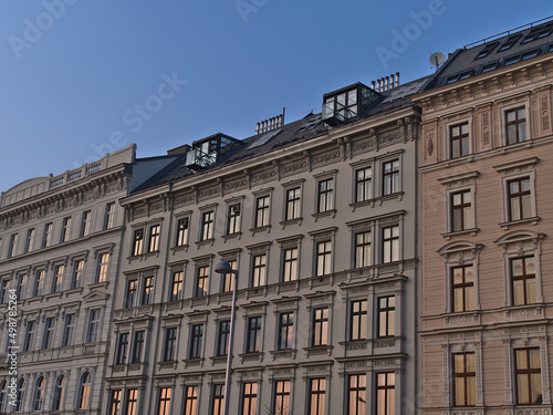 View of characteristic old buildings (constructed ca. 1900) in the historic center of city Vienna, Austria in the evening with decorative facades.