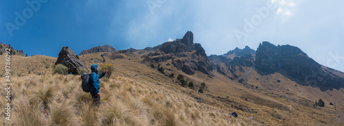 Young man hiking at iztaccihuatl mountain peak photo