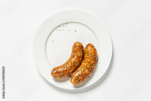 sausages on the white plate