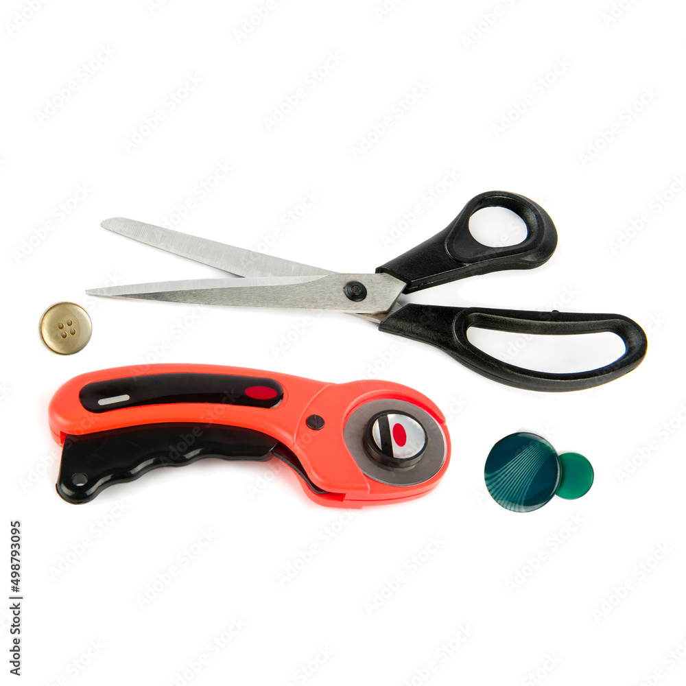 Rotary knife for patchwork and scissors isolated on white . Rotary knife for patchwork and scissors isolated on white .
