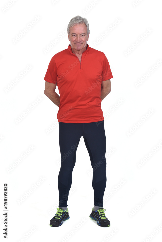 front view of a senior man with sportswear hands on back on white background