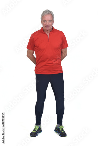 front view of a senior man with sportswear hands on back on white background