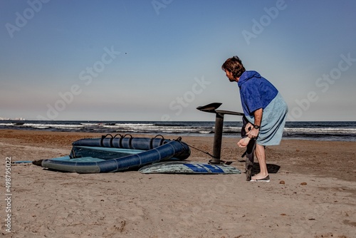 wing foil old kiter on the beach