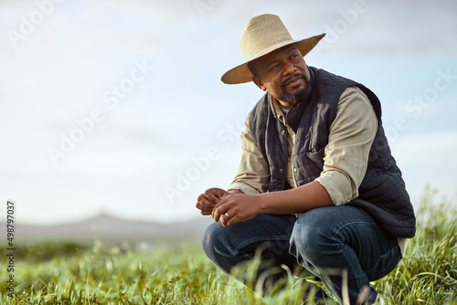 Theres patience and then theres farmer patience. Shot of a mature man working on a farm.