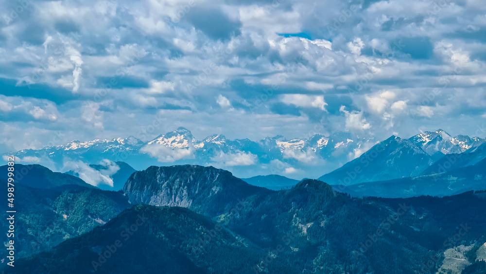 Scenic view on rocky sharp mountain summits of the Julian Alps and Kamnik Savinja Alps in Carinthia, border Austria and Slovenia. Mountain peaks in the Triglav National Park. Mountaineering. Freedom Scenic view on rocky sharp mountain summits of the Julian Alps and Kamnik Savinja Alps in Carinthia, border Austria and Slovenia. Mountain peaks in the Triglav National Park. Mountaineering. Freedom