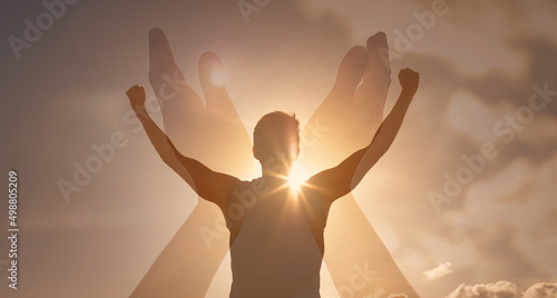 Strong man with worshiping hands up in the sky. Religious strength in god. 