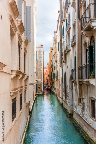 Morning in Venice  water channels along residential buildings  cityscape