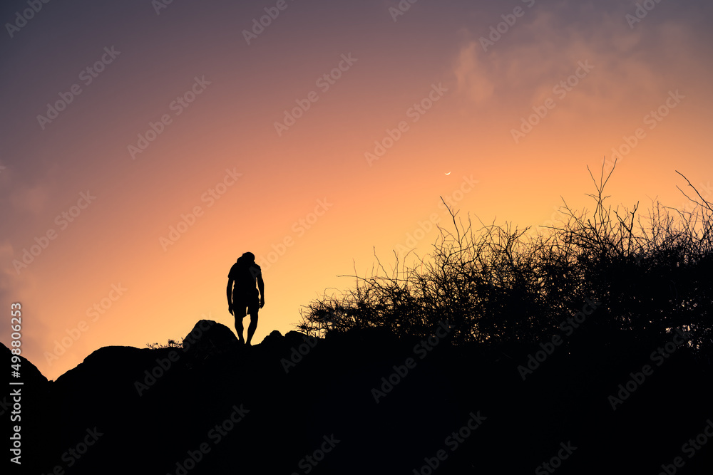 Man hiking cross country 