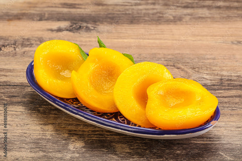 Sweet ripe canned peaches with mint Sweet ripe canned peaches with mint