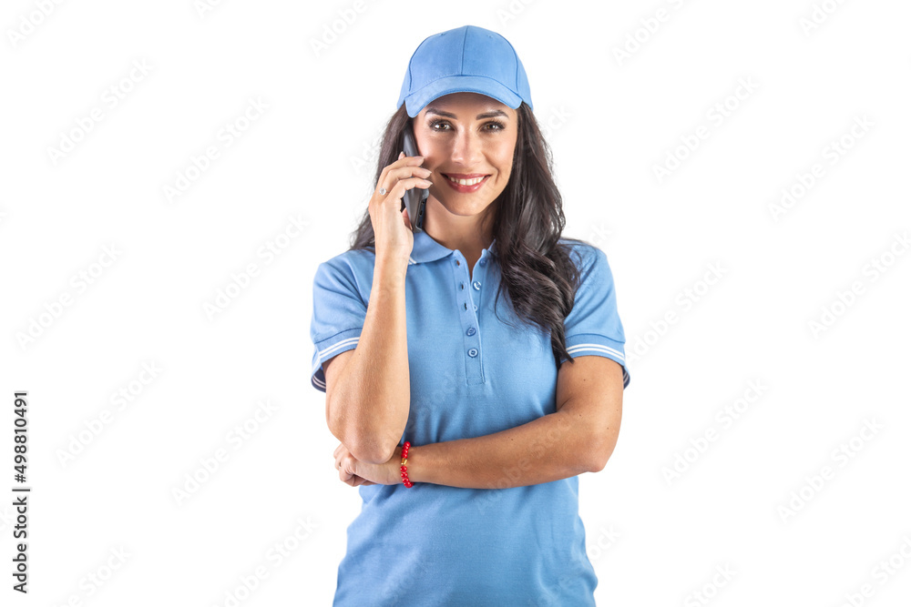 Attractive dark-haired delivery woman in blue uniform calling to a customer. Isolated background