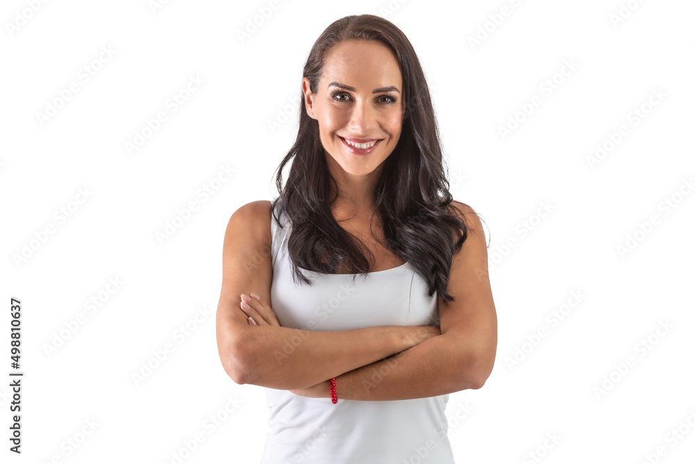 Studio portrait of an attractive dark-haired smiling woman with hands crossed in front of her chest. Isolated background Studio portrait of an attractive dark-haired smiling woman with hands crossed in front of her chest. Isolated background