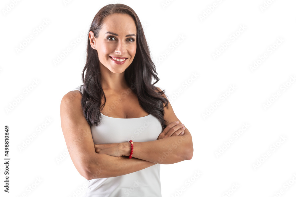 Studio portrait of an attractive dark-haired smiling woman with hands crossed in front of her chest. Isolated background Studio portrait of an attractive dark-haired smiling woman with hands crossed in front of her chest. Isolated background